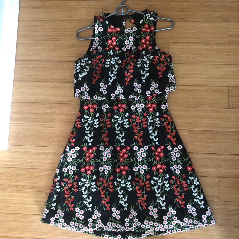 Beautiful embroidered flower over black dress